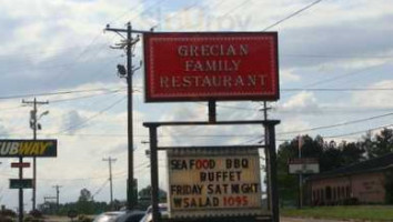 Grecian Family outside