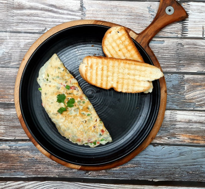 Masala Omelette Served With 2 Pcs Toast With Butter And Ketchup