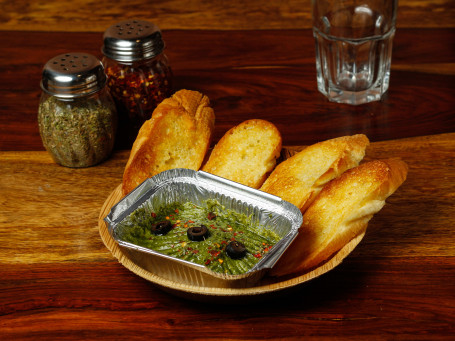 Pesto Hummus With Roasted Garlic Bread