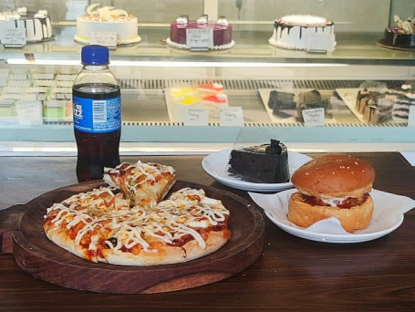 (Meal For 4). 2. Butter Paneer Pizza 8 2 Veg Burger 4 Pastry Or Brownie 4 Small Coke