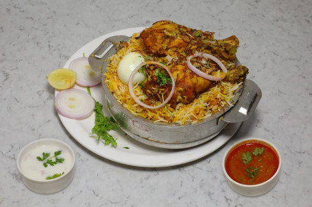 Chicken Double Joint Biryani Served With Raita And Salan (Serves 1)