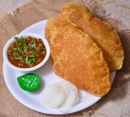 Chole Bhature( 1 Plate Served With Sliced Onions, Green Chilies, And Packaged Juice 180Ml On The Side)