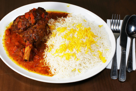 Mahiche Polo (Slow Cooked Lamb Shank In Tomato And Garlic Sauce With Saffron Rice)