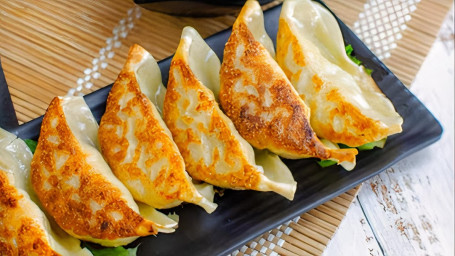 A4. Pork Gyoza Zhū Ròu Shuǐ Jiǎo