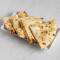 Tandoor Baked Naan Topped With Coconut Flakes And Dried Dates