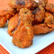 Alette Di Pollo Con Patatine Fritte